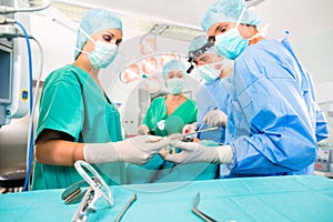 Surgeons in operating room in emergency