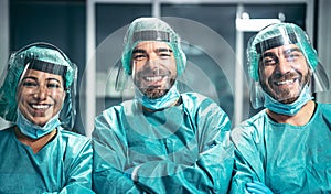 Surgeons smiling after a successful surgical operation - Medical workers the real heroes during corona virus outbreak