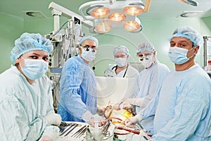 Surgeons team at cardiac surgery operation