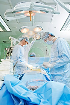 Surgeons team at cardiac surgery operation