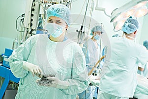 Surgeons team at cardiac surgery operation