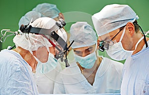 Surgeons team at operation photo