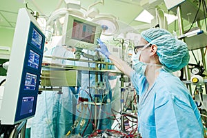 Surgery assistant perfusionist at modern heart lung machine