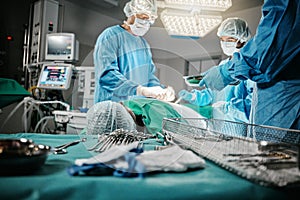 Surgery, doctor and nurse in hospital, theater and emergency room busy with operation in medical career. Employees