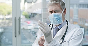 Surgery mask, gloves and senior doctor ready to start healthcare and wellness work in clinic. Hospital, elderly man and