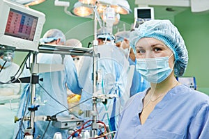 Surgery nurse working during operation