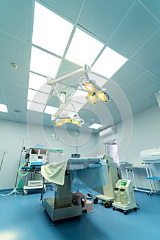 Surgery room in new modern hospital. Quarantine medical operating room with lights.