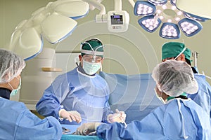 Surgery team operate