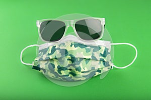 Surgical camo facemask and sunglasses