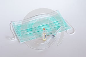 Surgical ear-loop mask and injection syringe