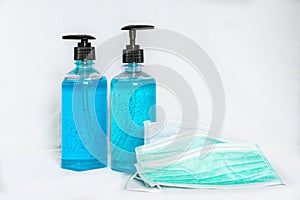 Surgical face masks and alcohol hand sanitizer gels for protecting covid-19 virus inflection on white background photo