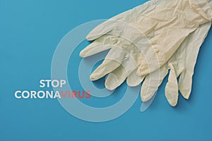Surgical gloves and text stop coronavirus