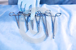 Surgical Instruments on green or blue background