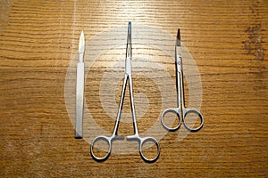 Surgical Instruments Set on Wooden Table photo