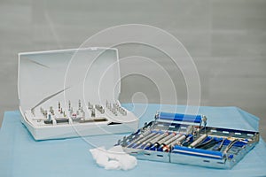 Surgical kit of instruments used in dental implantology. Dentist orthopedist tools. Dentistry. Dental implantation photo