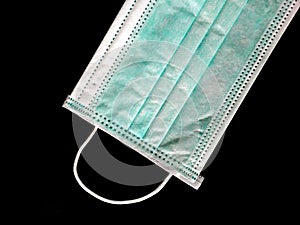 Surgical mask on black background