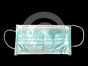 Surgical mask on black background