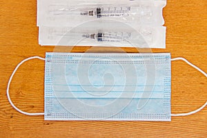 Surgical mask with rubber ear straps. Typical 3-ply surgical mask to cover the mouth and nose.Health protection concept