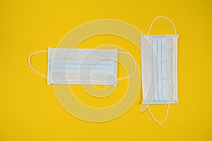 Surgical mask with rubber ear straps. Typical 3-ply surgical mask to cover the mouth and nose. Procedure mask from bacteria.