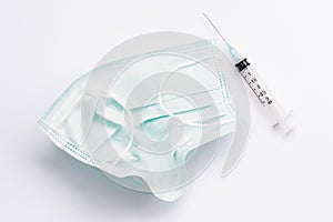 Surgical mask and syringe