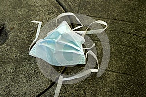 Surgical mask thrown on ground