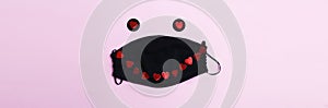 Surgical Medical face mask and red heart on pink background. Healthcare and valentines day concept. banner