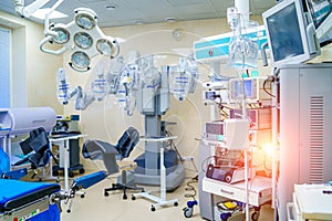 Surgical room in hospital with robotic technology equipment, machine arm surgeon in futuristic operation room