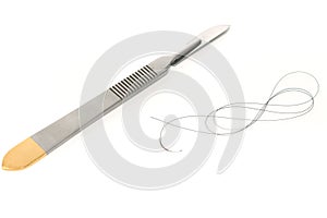 Surgical scalpel and suture
