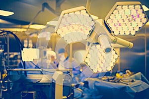 Surgical shadowless lamp in the equipped room on the background photo