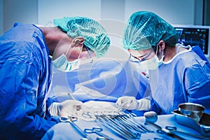 Surgical team performing surgery operation. Doctor performing surgery .