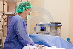 The surgical team is performing surgery for the patient in the operating room