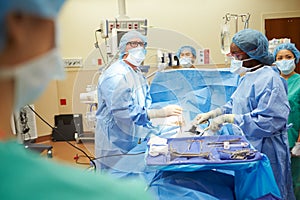 Surgical Team Working In Operating Theatre