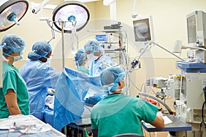 Surgical Team Working In Operating Theatre