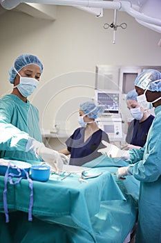 Surgical Team Working On Patient In Hospital Operating Theatre