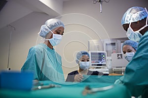 Surgical Team Working On Patient In Hospital Operating Theatre