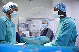 Surgical Team Working On Patient In Hospital Operating Theatre