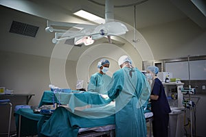 Surgical Team Working On Patient In Hospital Operating Theatre