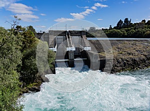 Surging wild white-water flowing through open dam gates at Aratiatia Taupo