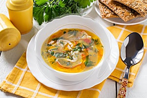 Surimi soup with potatoes, carrots, onions and herbs