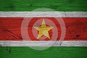 Suriname national flag painted old oak wood