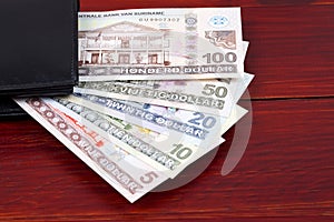 Surinamese Dollar in the black wallet photo