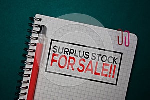 Surplus Stock For Sale!! write on a book isolated on green background