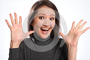 Surprise big excited expression from young woman photo