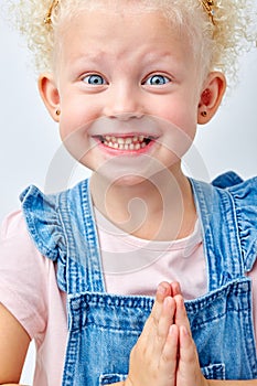 Surprise, excitement and fascination concept. Excited big blue eyed girl smiling, shocked