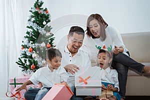 Surprise family opening a christmas gif