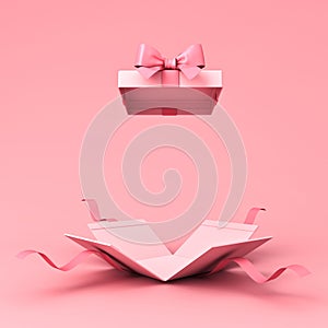 Surprise gift box or blank pink pastel color present box tied with pink ribbon and bow on light pink background