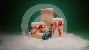 Surprise gifts for Christmas eve, snowbanks on stack of golden gift boxes dolly