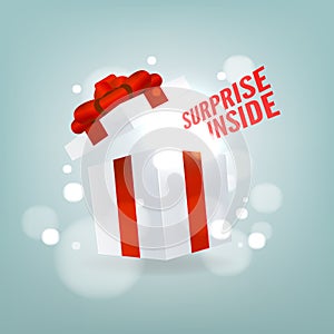 Surprise inside open gift box. Open white gift box with red ribbon and bow. Birthday surprise and Christmas present concept.