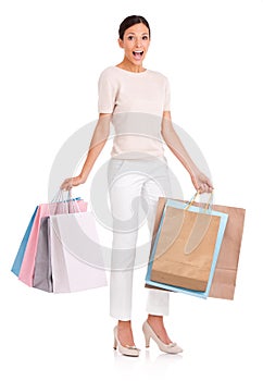 Surprise, shopping and portrait of woman on a white background with bag for sale, discount and deal. Excited, happy