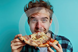 Surprise Yearold Man Eats Pizza On Turquoise Background photo